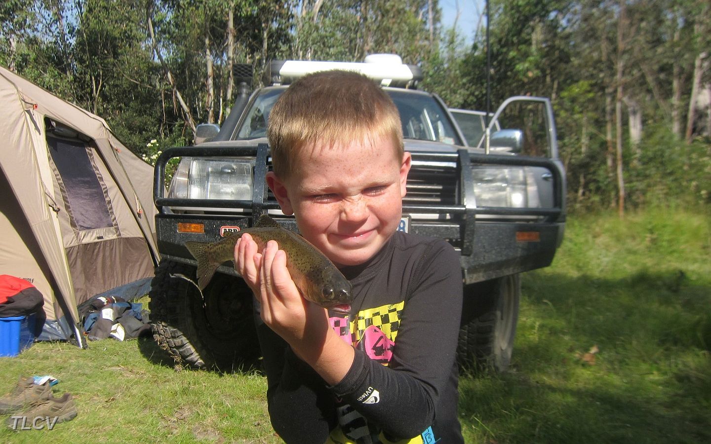 11-Owen with a brown trout caught by himself in the Murray River.JPG